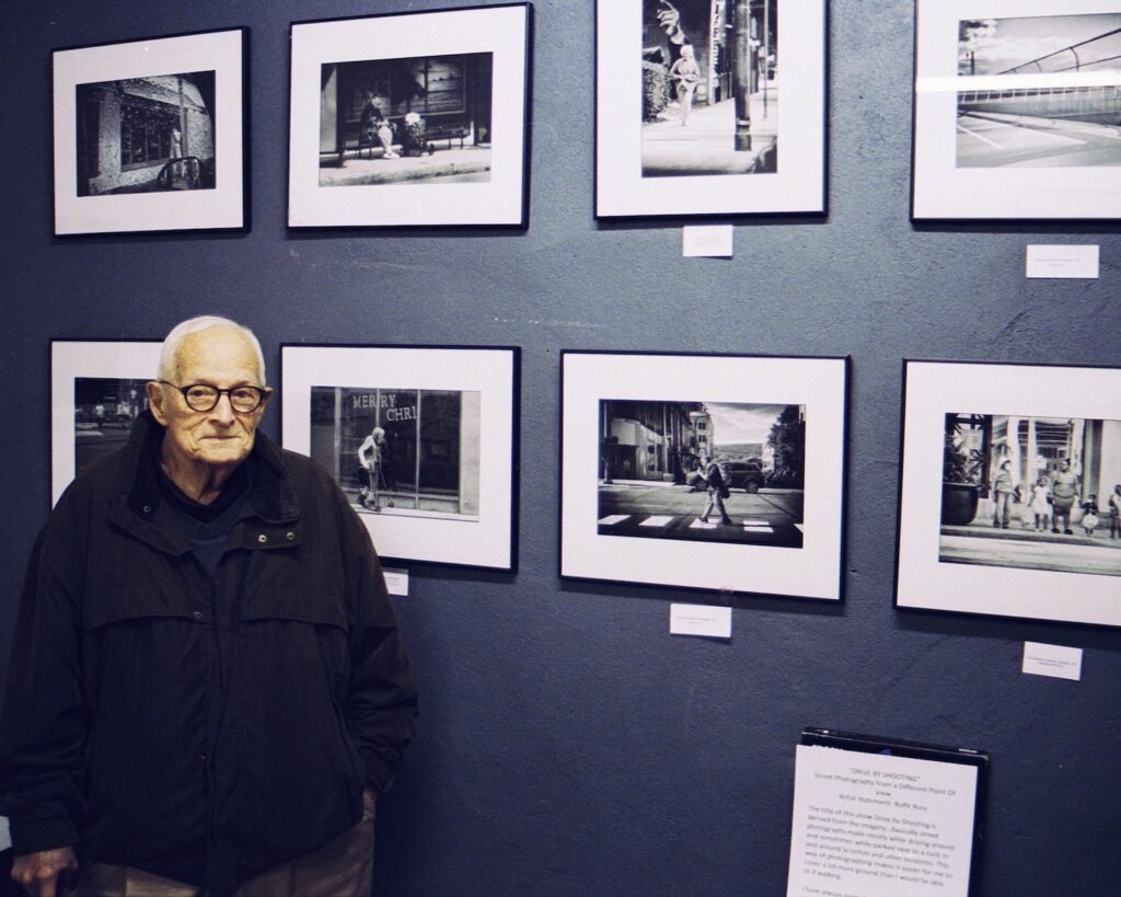 Rofle Ross with his photographs