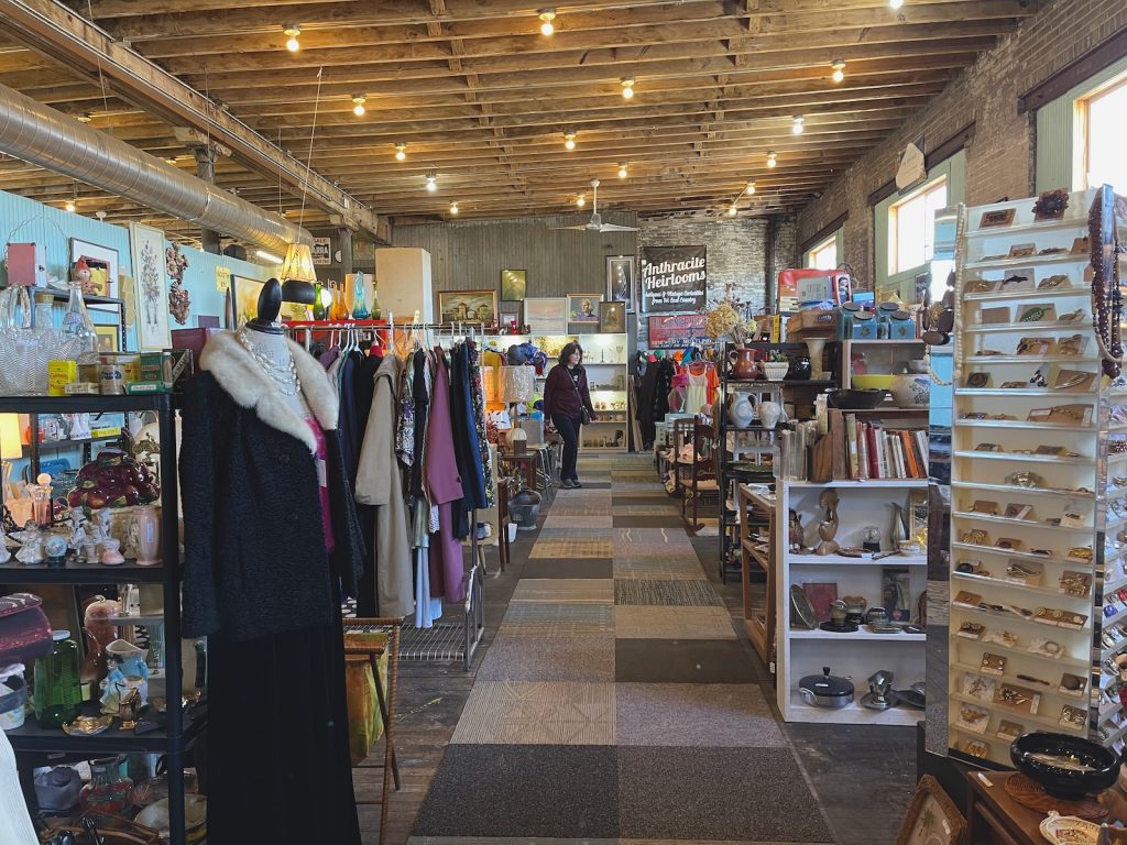 Odds and ends of an antique store line a long row.