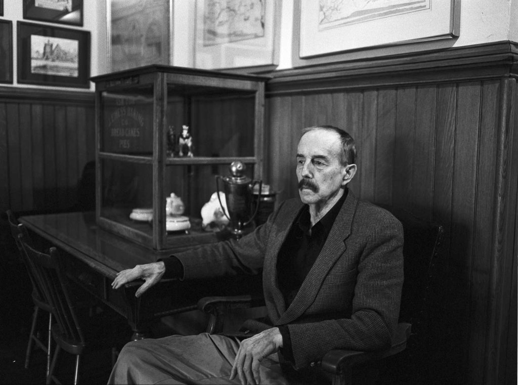 S. Robert Powell, Ph.D. at the Carbondale Historical Society sitting in the hall way of the museum.