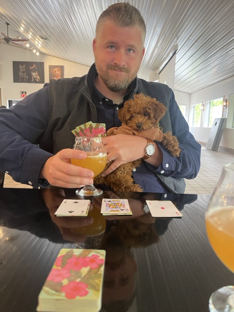 Me and Kona Barkley, a red toy poodle in a dog-encouraged brewery.
